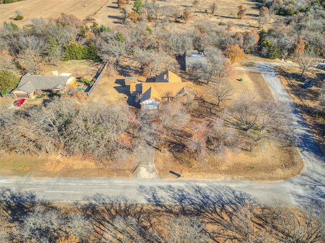 birds eye view of property with a rural view