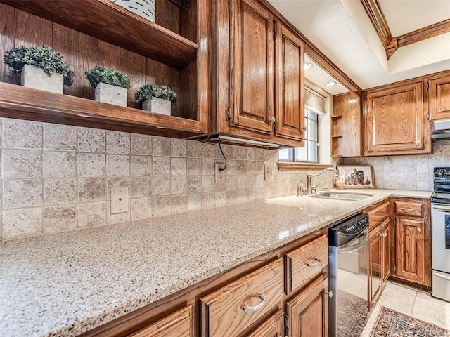 kitchen with sink, ornamental molding, appliances with stainless steel finishes, light tile patterned flooring, and light stone counters