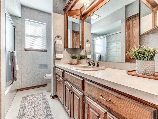 full bathroom featuring shower / bath combination with glass door, vanity, and toilet