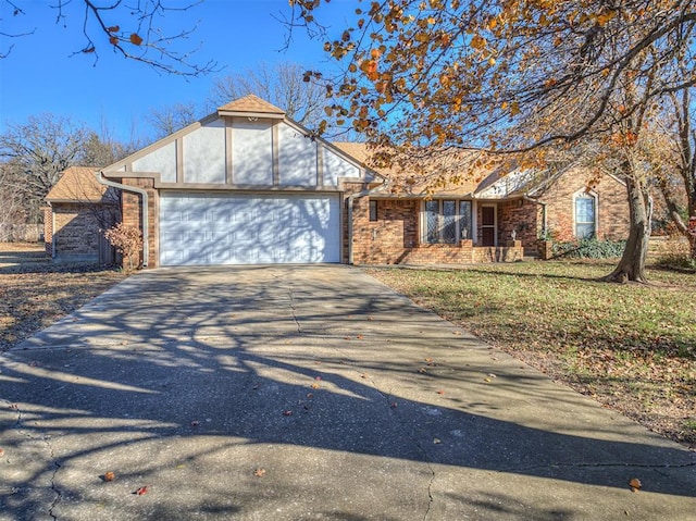 view of front facade with a garage and a front lawn