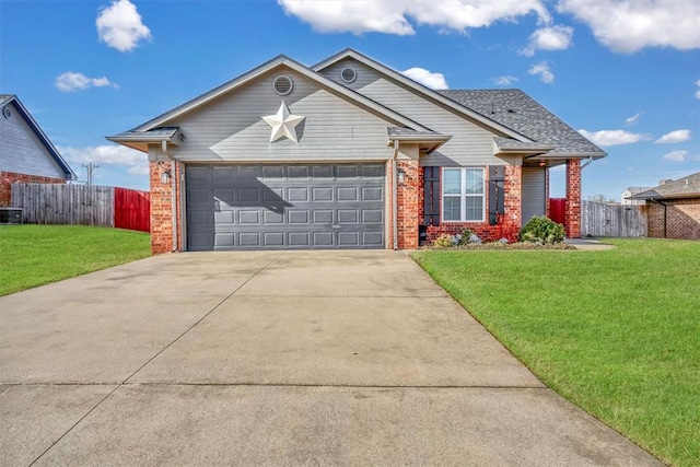 103 Ranch Rd, Elk City, OK 73644 - view of front facade with central AC unit, a garage, and a front yard