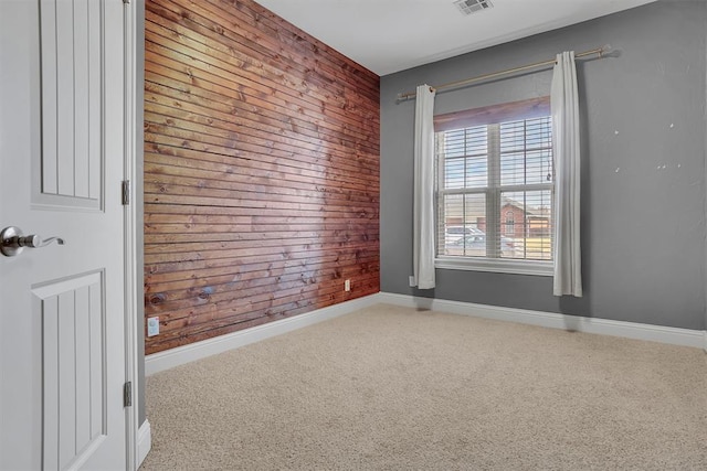 103 Ranch Rd, Elk City, OK 73644 - unfurnished room with wooden walls and carpet floors