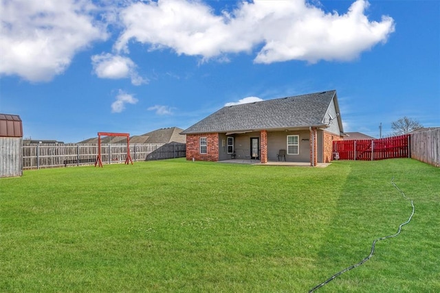 103 Ranch Rd, Elk City, OK 73644 - rear view of property with a lawn and a patio