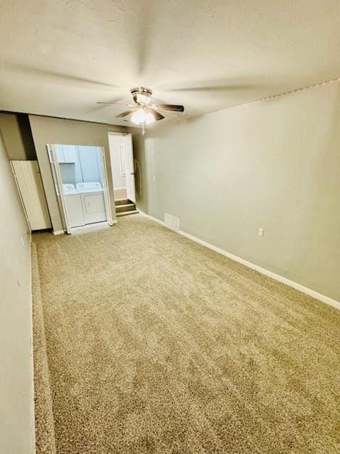 unfurnished bedroom with carpet, separate washer and dryer, and ceiling fan