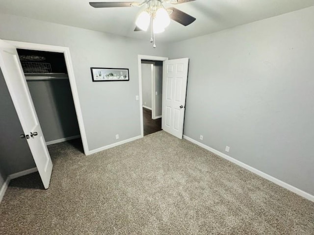 unfurnished bedroom featuring carpet, ceiling fan, and a closet