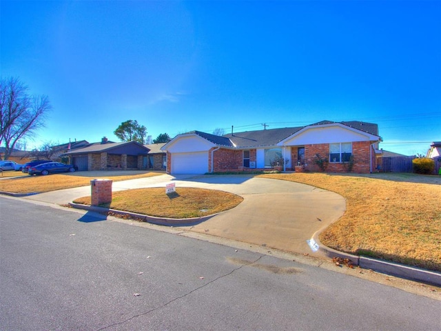 ranch-style house with a garage and a front lawn