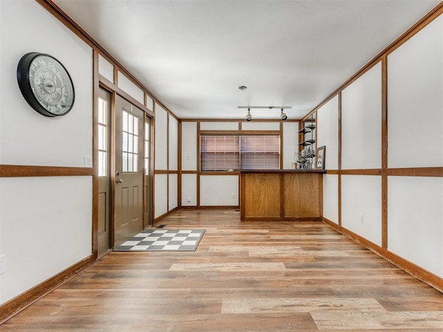 interior space featuring light hardwood / wood-style floors and track lighting