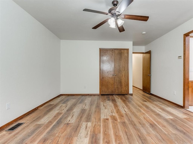 unfurnished bedroom featuring ceiling fan and light wood-type flooring