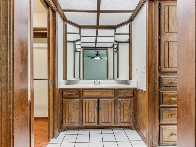 bathroom featuring tile patterned flooring, ceiling fan, and vanity