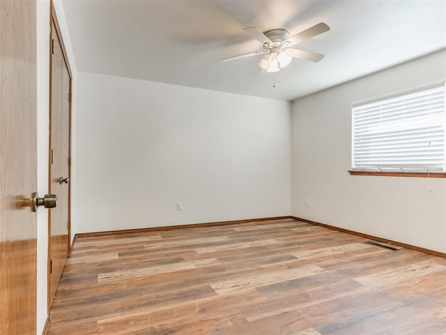 unfurnished room with ceiling fan and light hardwood / wood-style floors