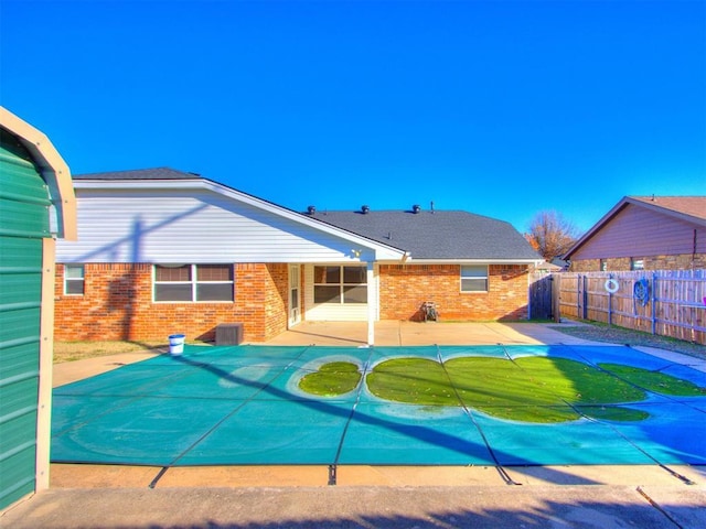 view of pool with central AC and a patio area