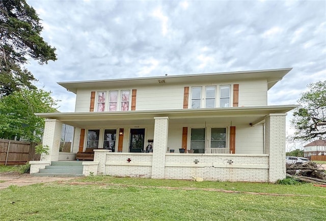 view of front of home featuring a porch and a front yard