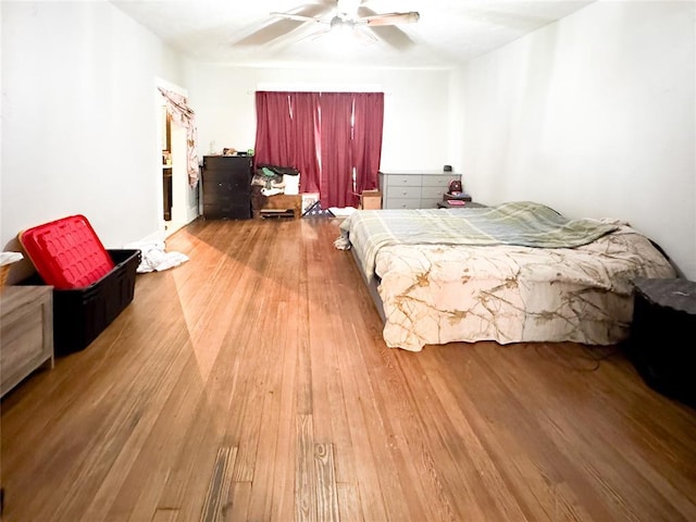 bedroom with ceiling fan and light wood-type flooring