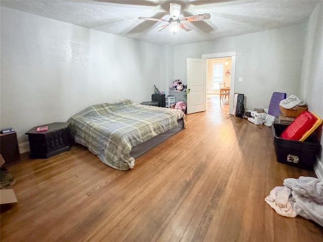 bedroom featuring ceiling fan and wood-type flooring