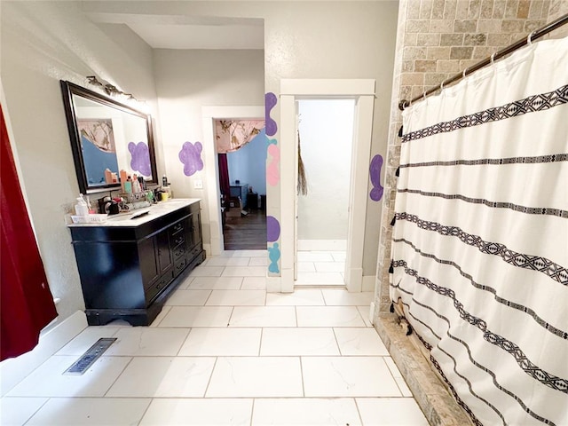 bathroom featuring vanity and curtained shower