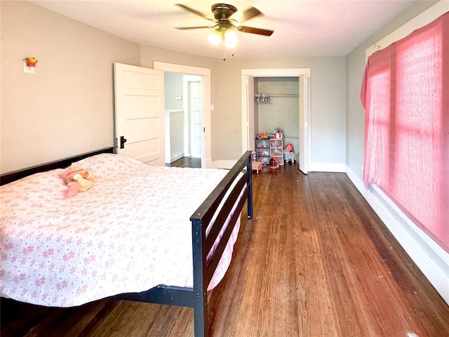 bedroom featuring a closet, ceiling fan, and dark hardwood / wood-style flooring