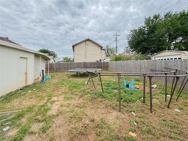 view of yard with a trampoline