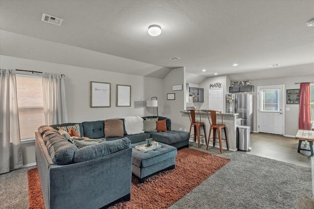 living room with vaulted ceiling