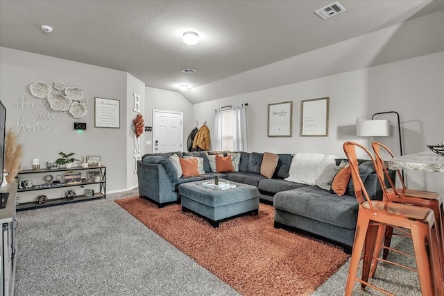 carpeted living room featuring lofted ceiling