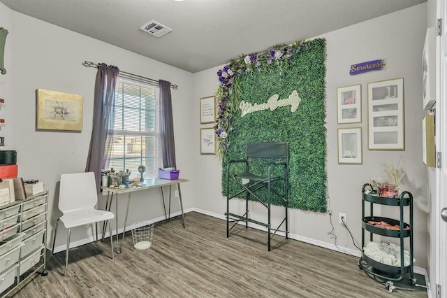 living area with wood-type flooring