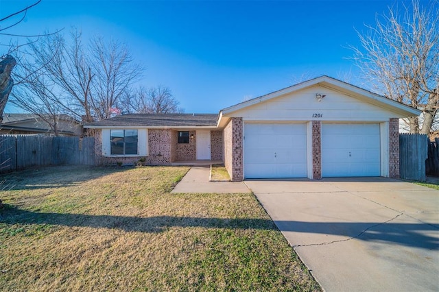 ranch-style home with a garage and a front lawn