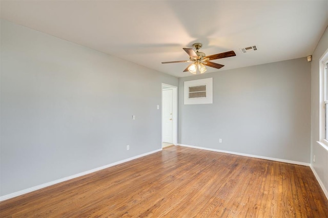 spare room with ceiling fan and light hardwood / wood-style floors