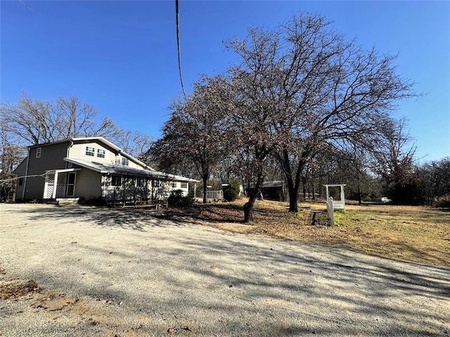 view of property exterior featuring driveway