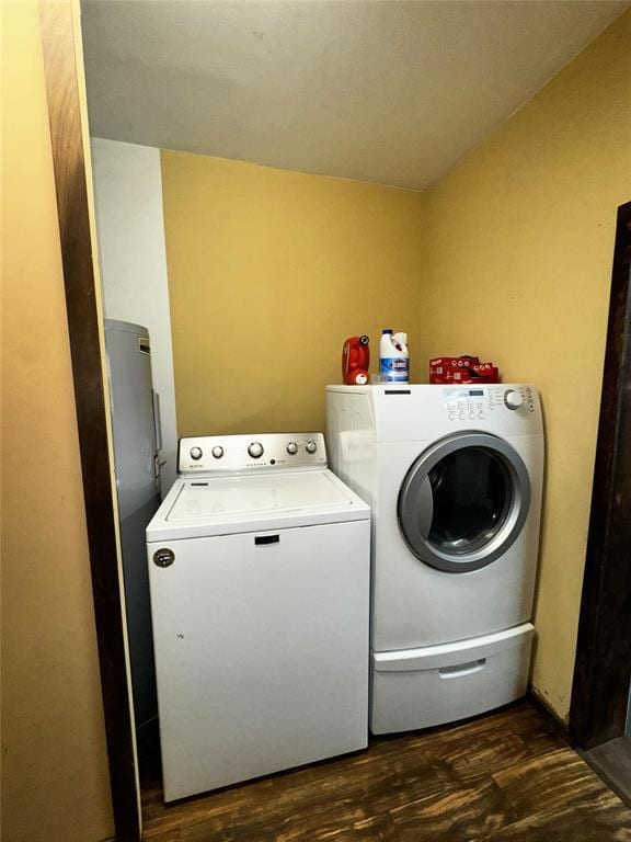 laundry area featuring separate washer and dryer and dark wood-type flooring