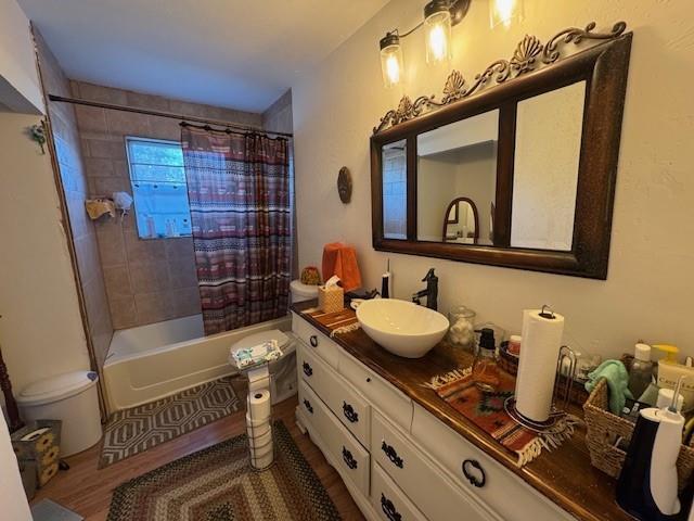 full bath with vanity and shower / bathtub combination with curtain