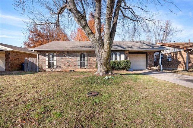 single story home with a front lawn and a garage