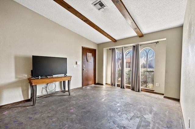 unfurnished living room featuring a textured ceiling and lofted ceiling with beams