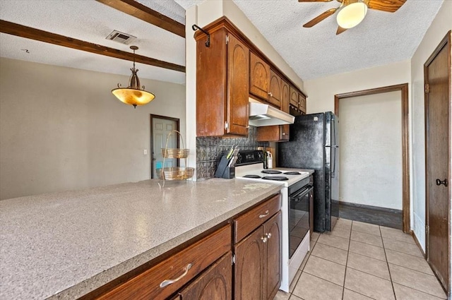 kitchen with hanging light fixtures, white electric stove, a textured ceiling, decorative backsplash, and light tile patterned floors