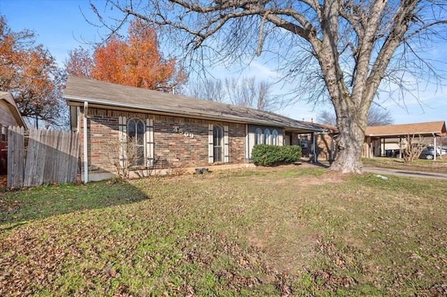 rear view of house with a lawn