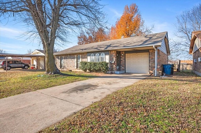 ranch-style home featuring a front yard, a garage, and a carport