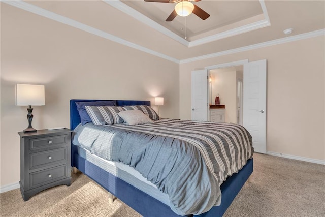 bedroom featuring ceiling fan, crown molding, light carpet, and connected bathroom