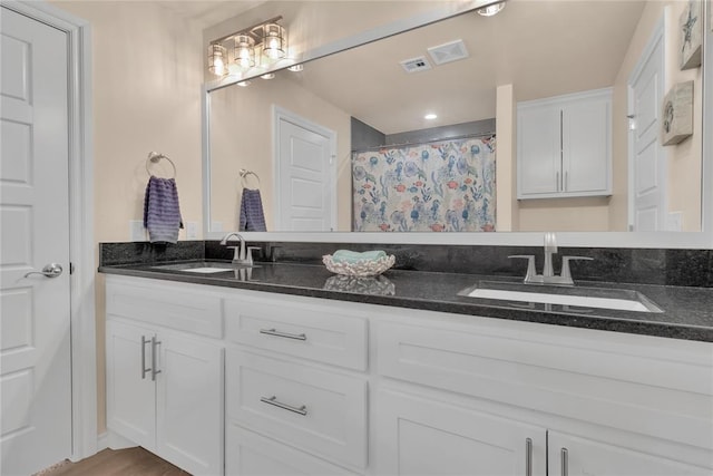 bathroom with a shower with shower curtain, vanity, and wood-type flooring