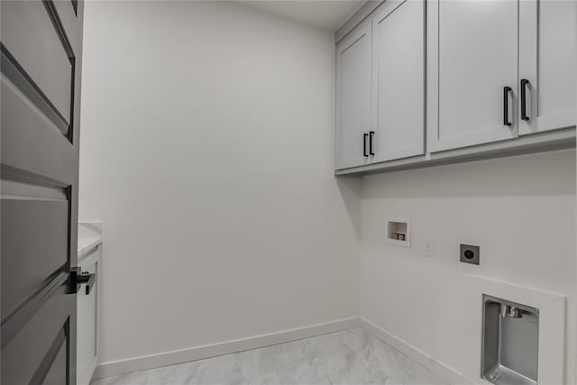 laundry area featuring electric dryer hookup, cabinets, and washer hookup