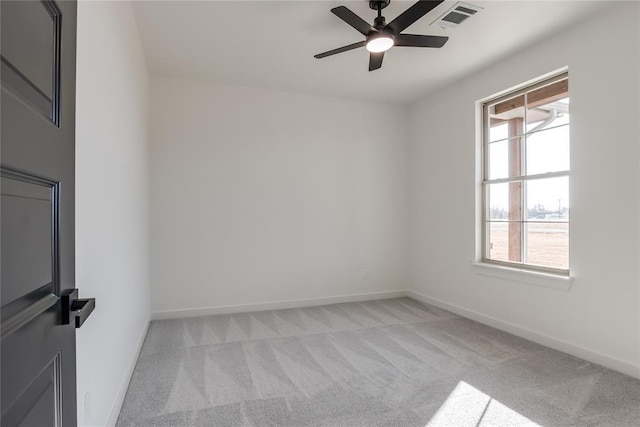 empty room featuring light carpet and ceiling fan