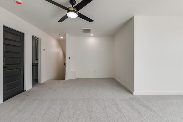 carpeted empty room with ceiling fan