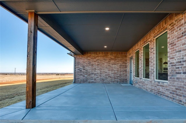 view of patio / terrace with a rural view