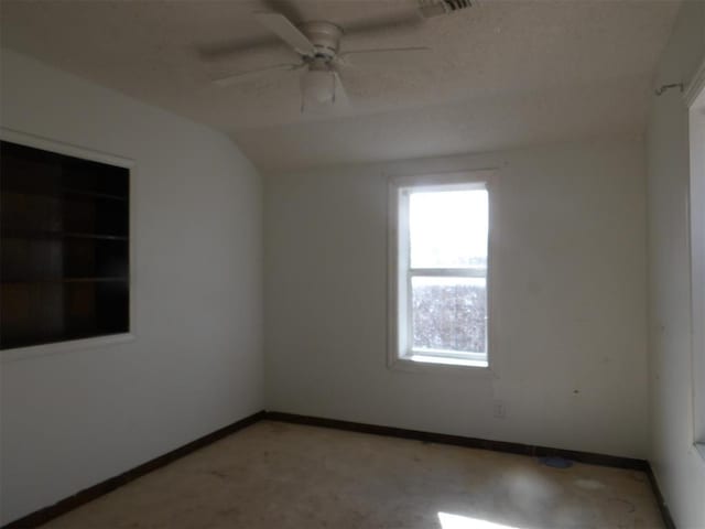 spare room with ceiling fan and lofted ceiling