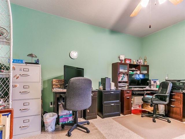 carpeted home office with ceiling fan