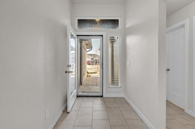 entryway featuring light tile patterned floors