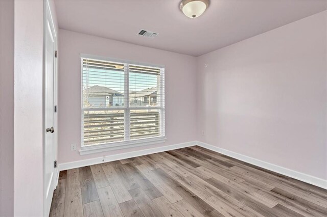 empty room with light wood-type flooring