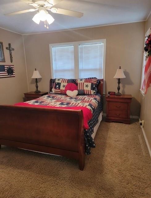 bedroom with ceiling fan, carpet floors, and ornamental molding