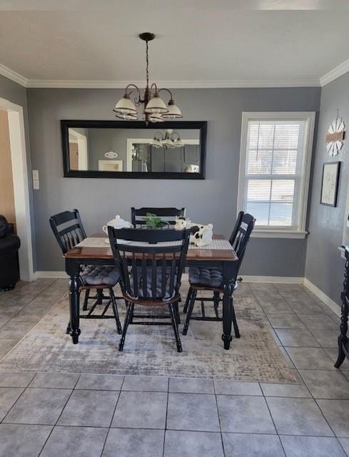 tiled dining space with crown molding and an inviting chandelier