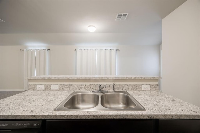 kitchen featuring dishwasher and sink