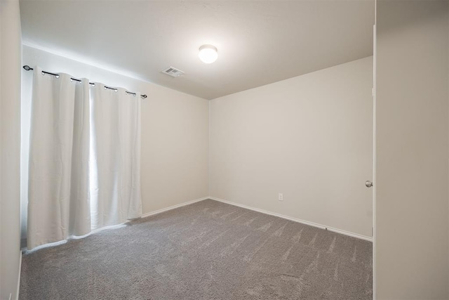 spare room featuring carpet flooring