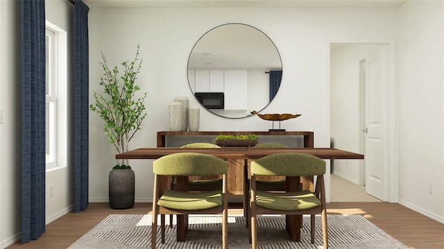 dining area with hardwood / wood-style flooring