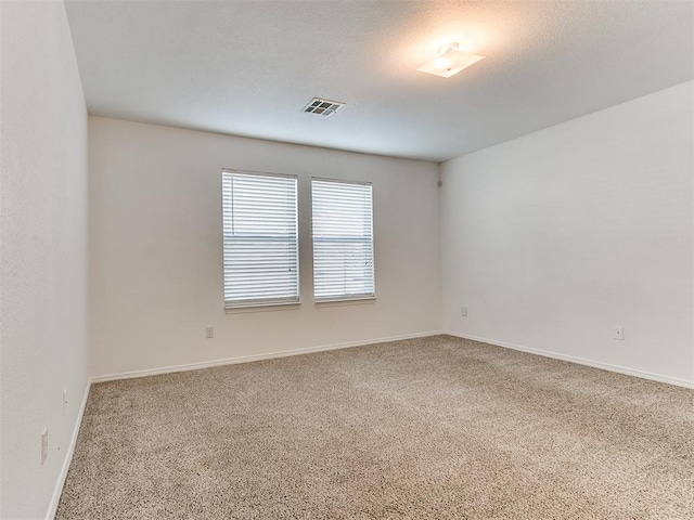 unfurnished room featuring carpet floors